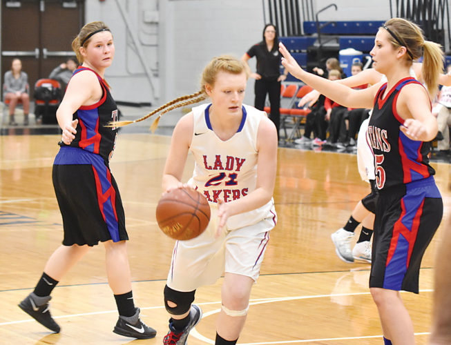 Garrick Hodge/MDN Des Lacs-Burlington's Brooklyn Benno (21) is defended by Towner-Granville-Upham's Lexi Zahn (15) during a girls high school basketball game on Thursday at the Minot Auditorium. DL-B defeated TGU 48-23. 